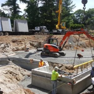installing precast foundation for seaside home in Guilford, CT