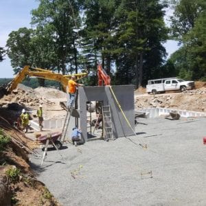 installing precast foundation for seaside home in Guilford, CT