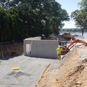 installing precast foundation for seaside home in Guilford, CT