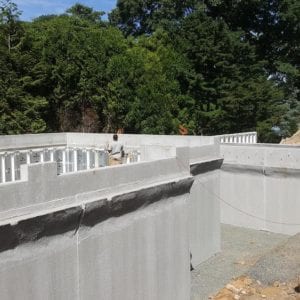installing precast foundation for seaside home in Guilford, CT