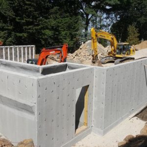 installing precast foundation for seaside home in Guilford, CT