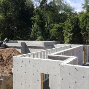 installing precast foundation for seaside home in Guilford, CT