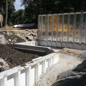 installing precast foundation for seaside home in Guilford, CT