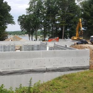 installing precast foundation for seaside home in Guilford, CT
