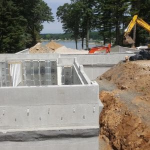 installing precast foundation for seaside home in Guilford, CT