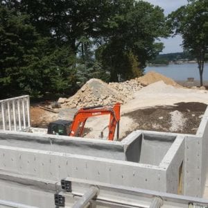 installing precast foundation for seaside home in Guilford, CT