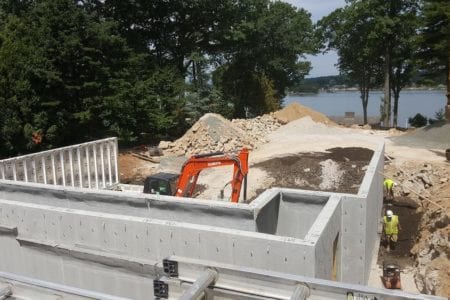 installing precast foundation for seaside home in Guilford, CT