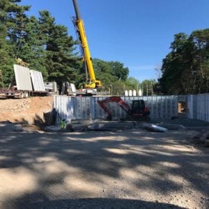 installing precast foundation for seaside home in Guilford, CT