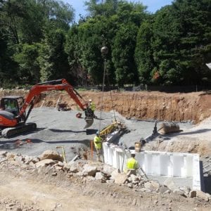 installing precast foundation for seaside home in Guilford, CT