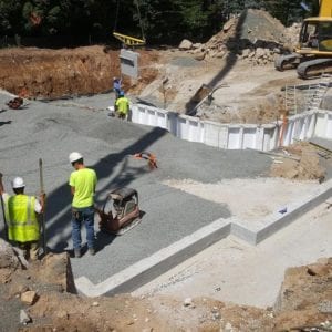installing precast foundation for seaside home in Guilford, CT
