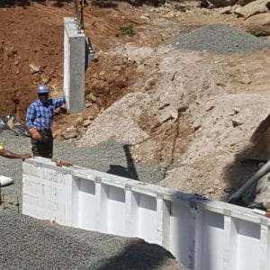 installing precast foundation for seaside home in Guilford, CT