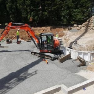 installing precast foundation for seaside home in Guilford, CT